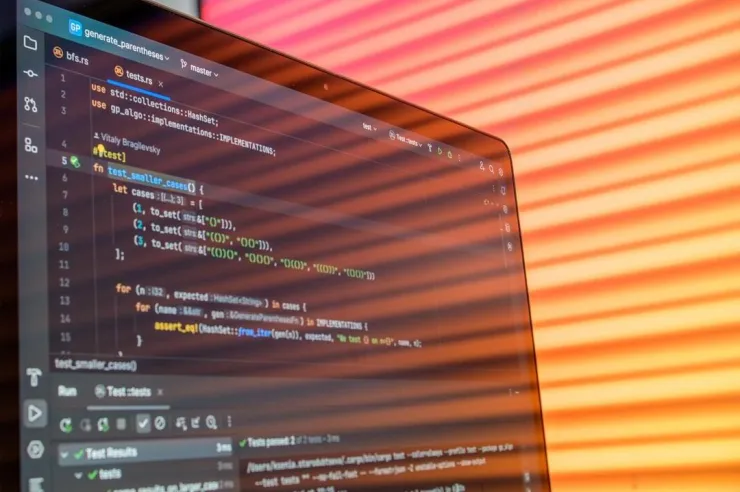 Code editor showing passing tests on a laptop screen